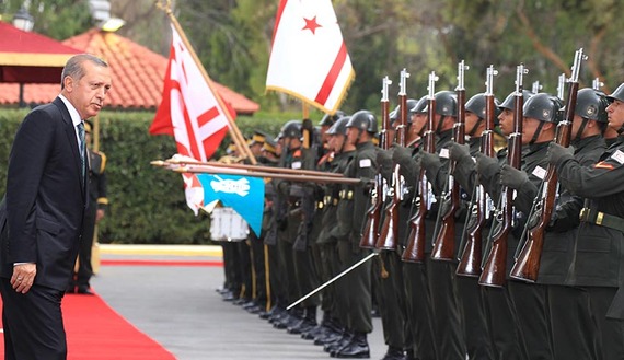 Turkey's President Tayyip Erdogan inspects the honour guard during a visit to Northern Cyprus